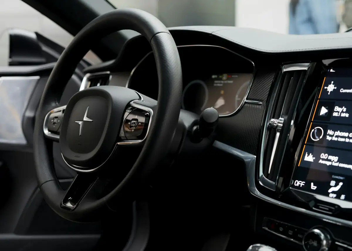 the interior of a car with a steering wheel